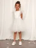 Younger Girls Ruffle Tulle Midi Dress in White sold by Chi Chi London