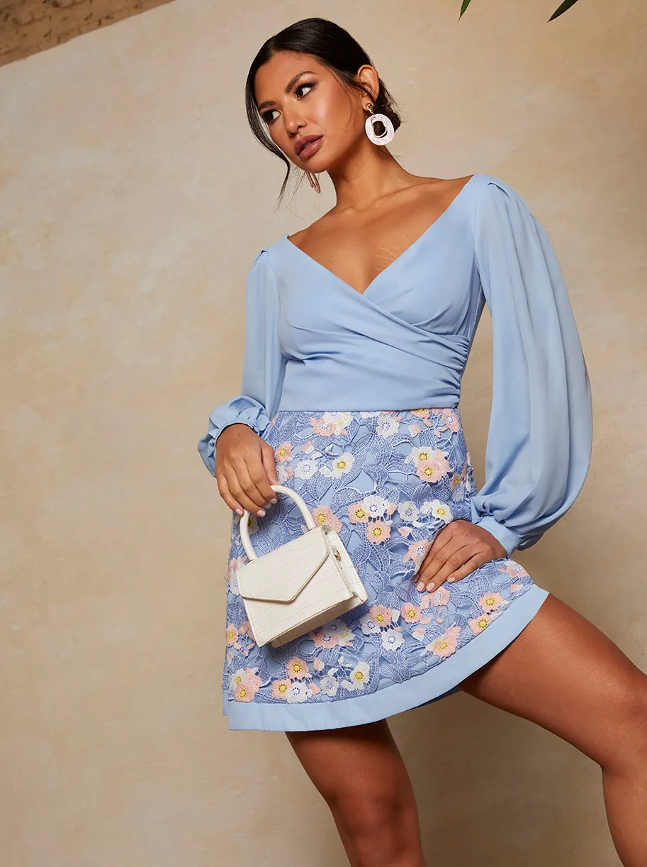 Wrap Front Premium Lace Mini Dress in Blue sold by Chi Chi London