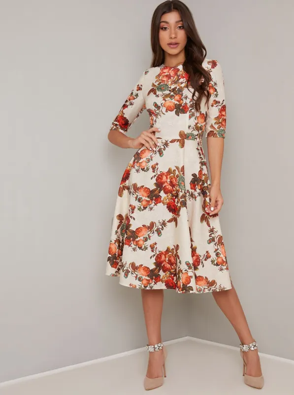 Textured Short Sleeved Floral Midi Dress in Cream sold by Chi Chi London
