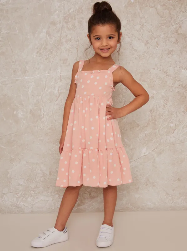Girls Sleeveless Polka Dot Midi Dress in Pink sold by Chi Chi London
