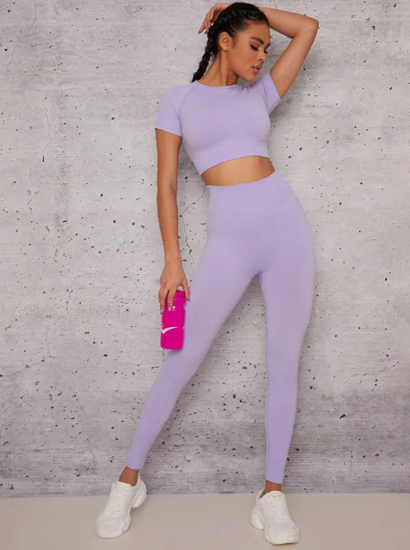 Short Sleeved Cropped Sports Top in  Purple sold by Chi Chi London