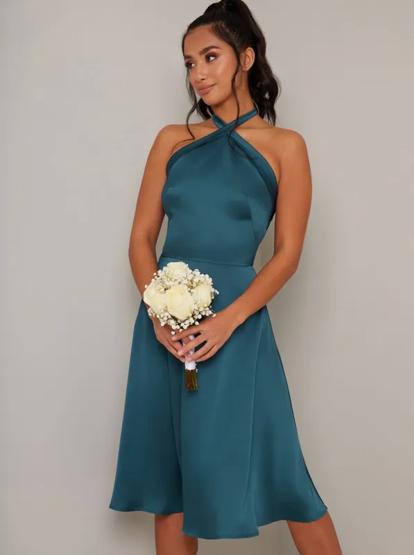 Petite Halter Neck Dip Hem Backless Dress in Green sold by Chi Chi London