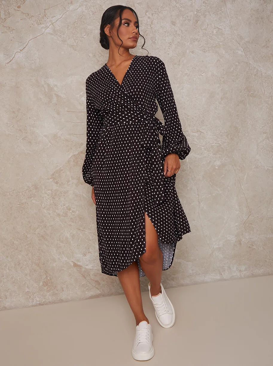 Long Sleeve Polka Dot Midi Wrap Dress in Black sold by Chi Chi London