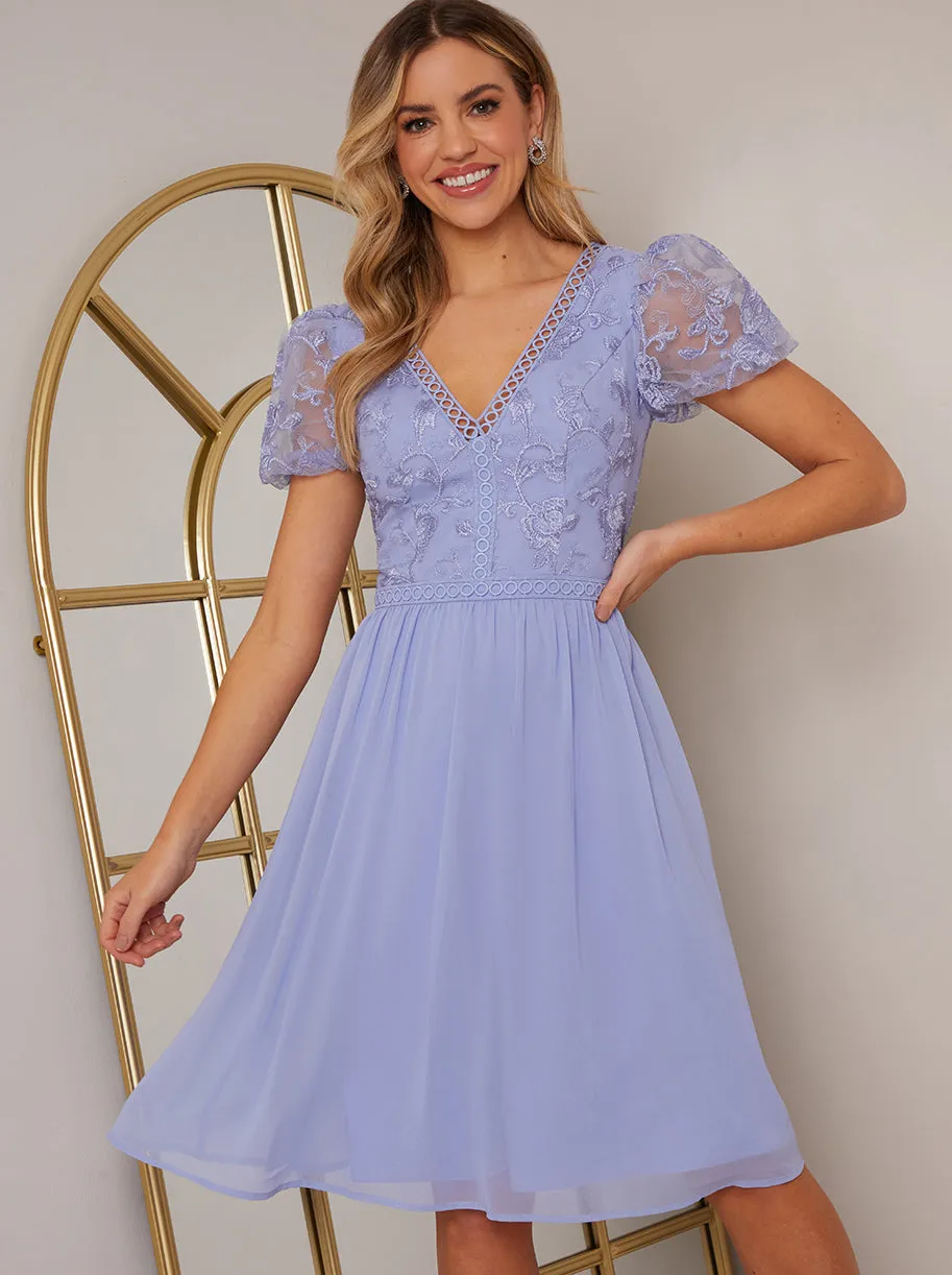 Puff Sleeve V Neck Embroidered Lace Midi Dress in Blue sold by Chi Chi London