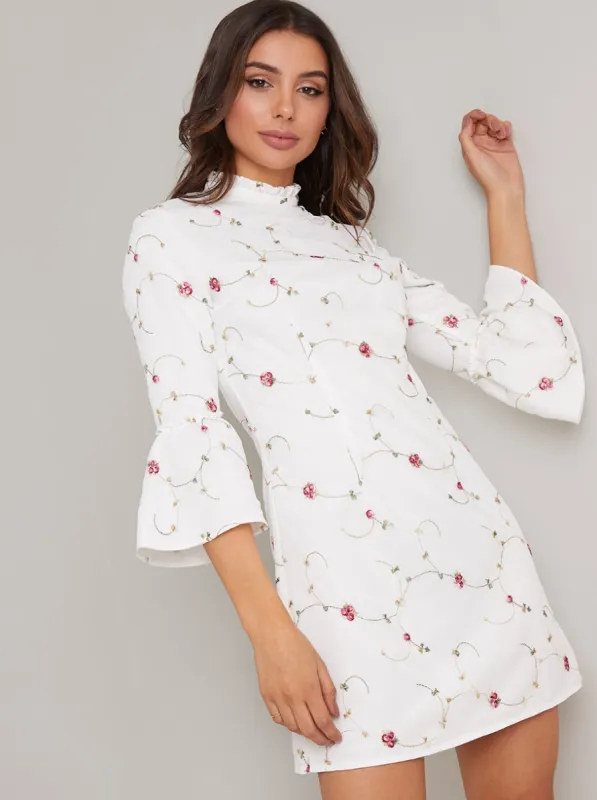 Flute Sleeve Floral Print Mini Dress in White sold by Chi Chi London
