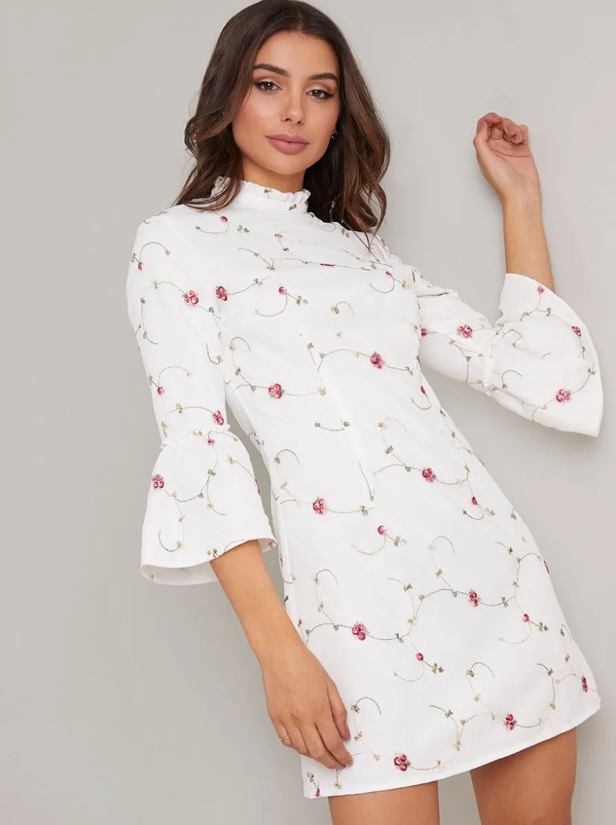 Flute Sleeve Floral Print Mini Dress in White sold by Chi Chi London