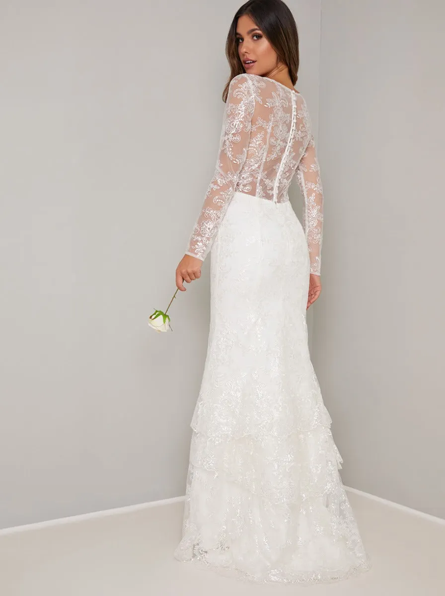 Bridal Lace Long Sleeved Tiered Wedding Dress in White sold by Chi Chi London