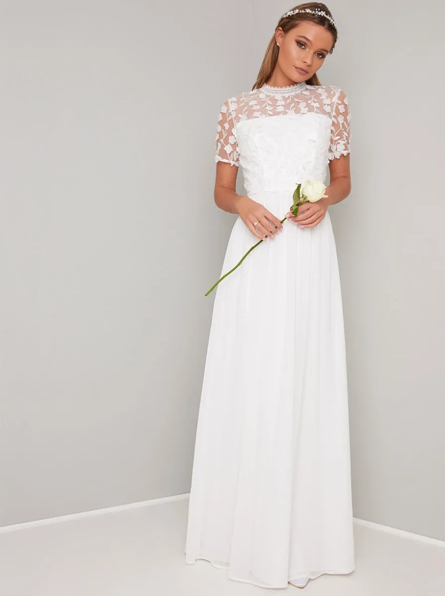 Bridal Short Sleeved 3D Lace Wedding Dress in White sold by Chi Chi London