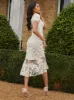 Embroidered Short Sleeve Midi Dress in Yellow sold by Chi Chi London