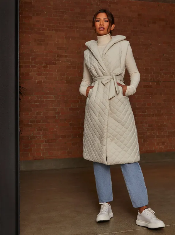 Diamond Quilted Longline Belted Gilet in Cream sold by Chi Chi London