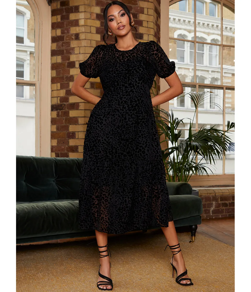 Chi Chi London Short Sleeve Sheer Detail Dobby Midi Dress in Black sold by Chi Chi London