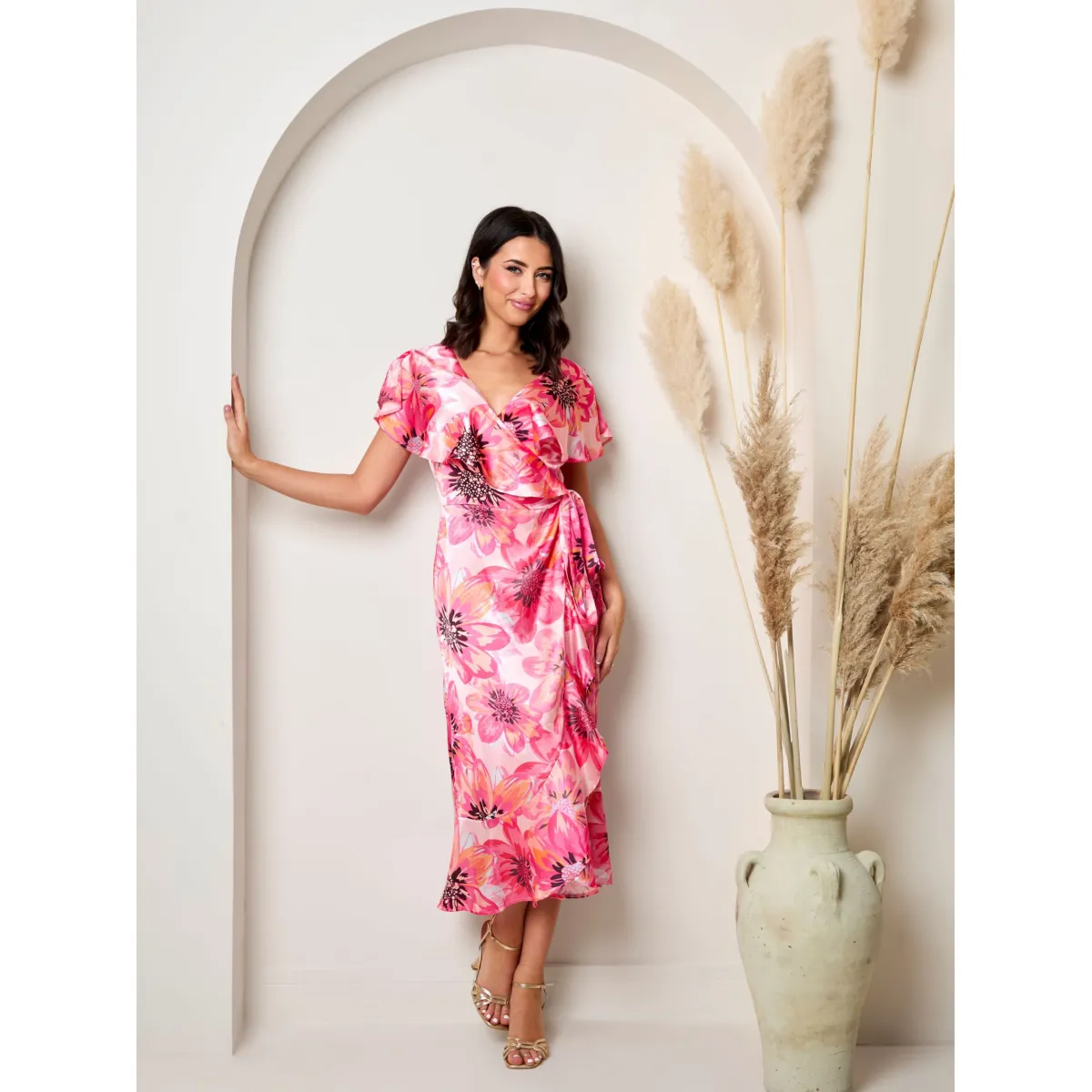 Chi Chi London Flutter Sleeve Satin Wrap Dress in Pink sold by Chi Chi London