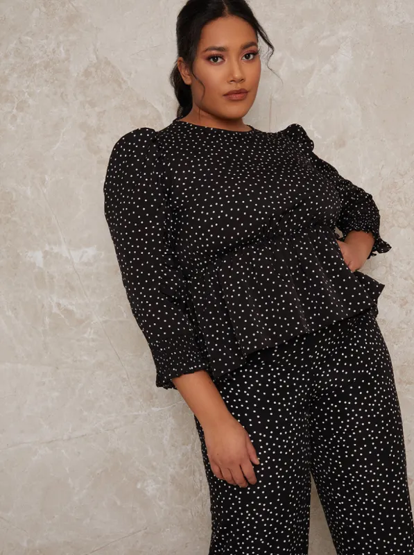 Plus Size Polka Dot Peplum Top in Mono sold by Chi Chi London