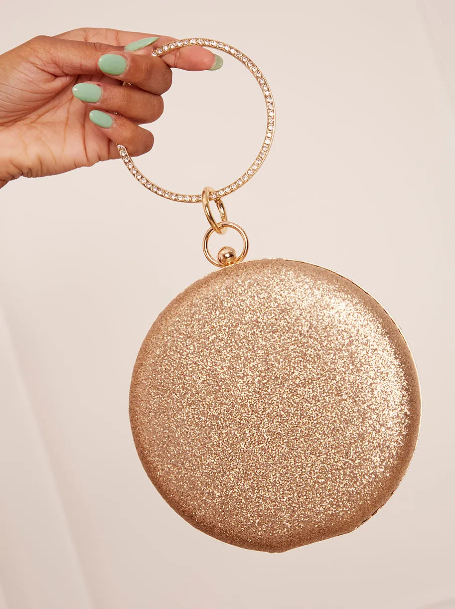 Diamante Ring Handle Glitter Bag in Gold sold by Chi Chi London