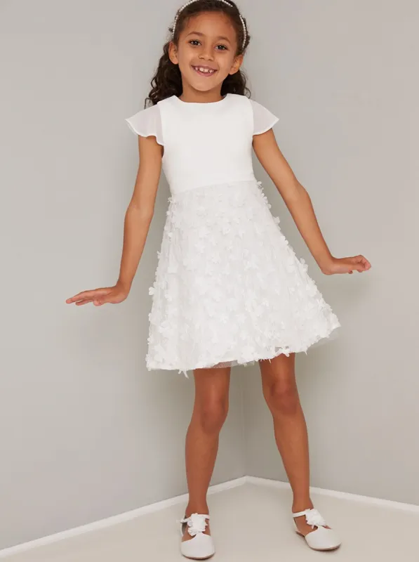 Girls Cap Sleeved 3D Floral Dress in White sold by Chi Chi London