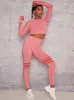 Eyelet Detail Long Sleeve Gym Top in Pink sold by Chi Chi London