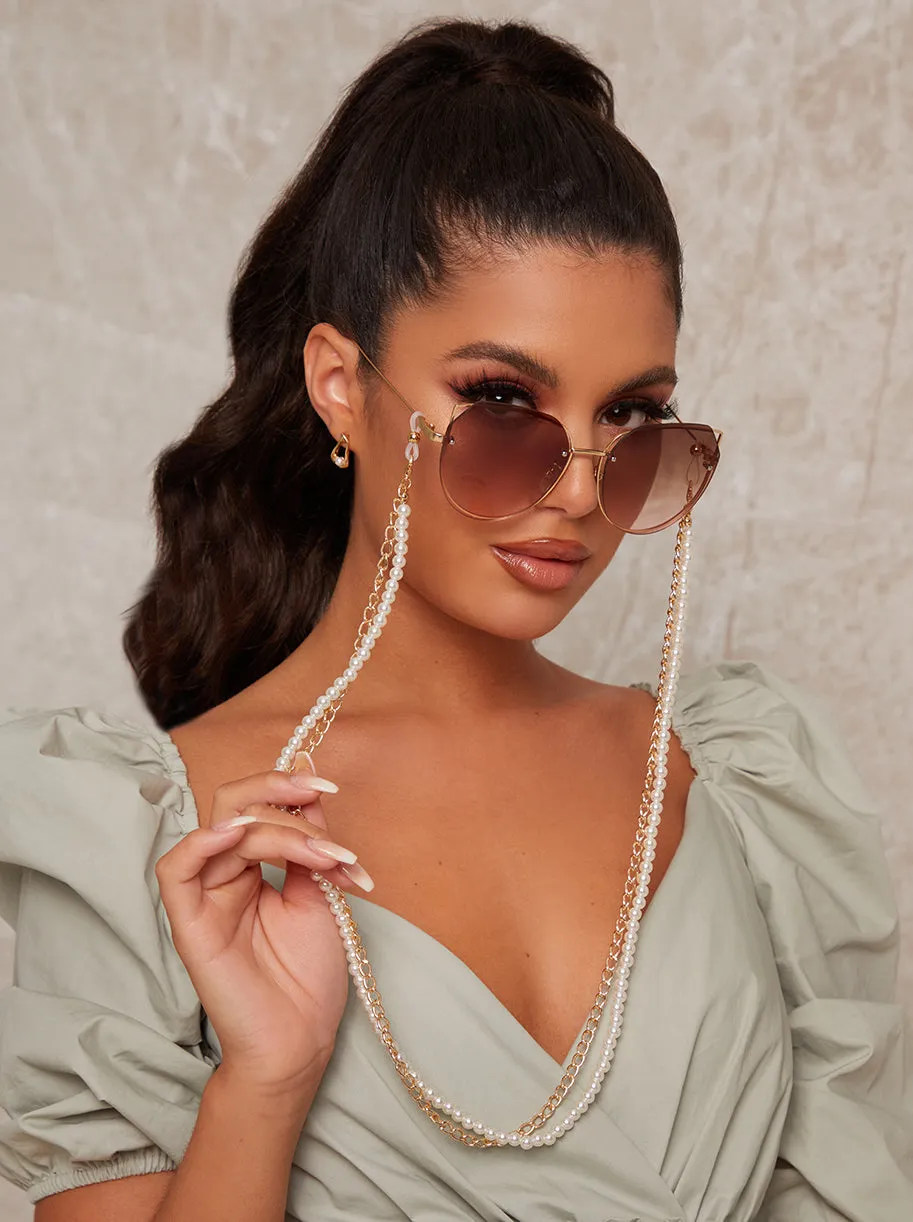 Pearl Sunglasses Chain in Gold sold by Chi Chi London