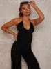 Halter Neck Tie Back Jumpsuit in Black sold by Chi Chi London