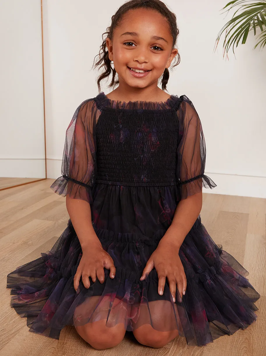 Younger Girls Puff Sleeve Shirred Floral Midi Dress in Black sold by Chi Chi London