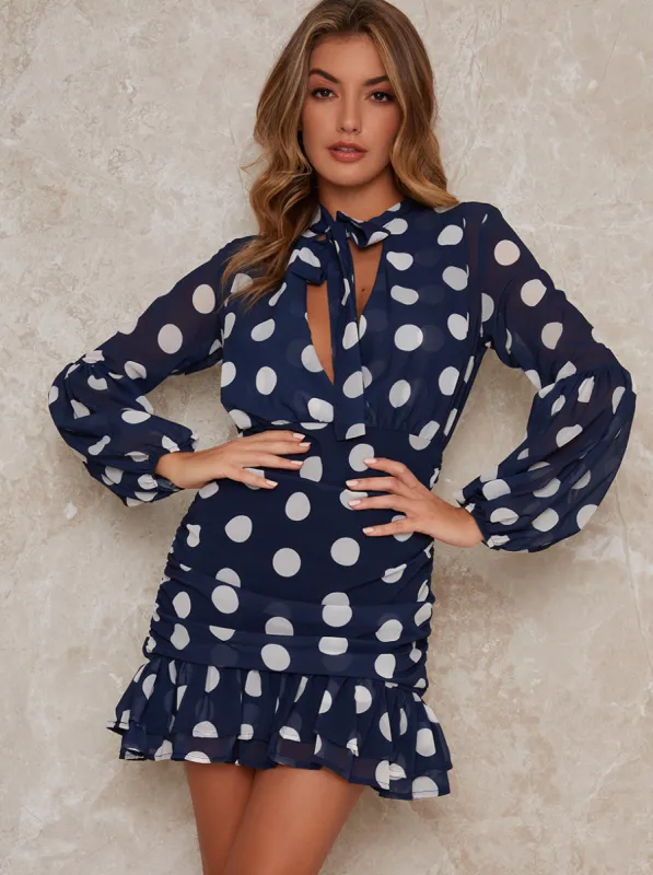 Long sleeved ruffle spot mini dress in blue sold by Chi Chi London