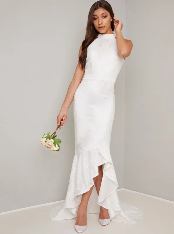 Bridal Embroidered Fishtail Dip Hem Wedding Dress in White sold by Chi Chi London