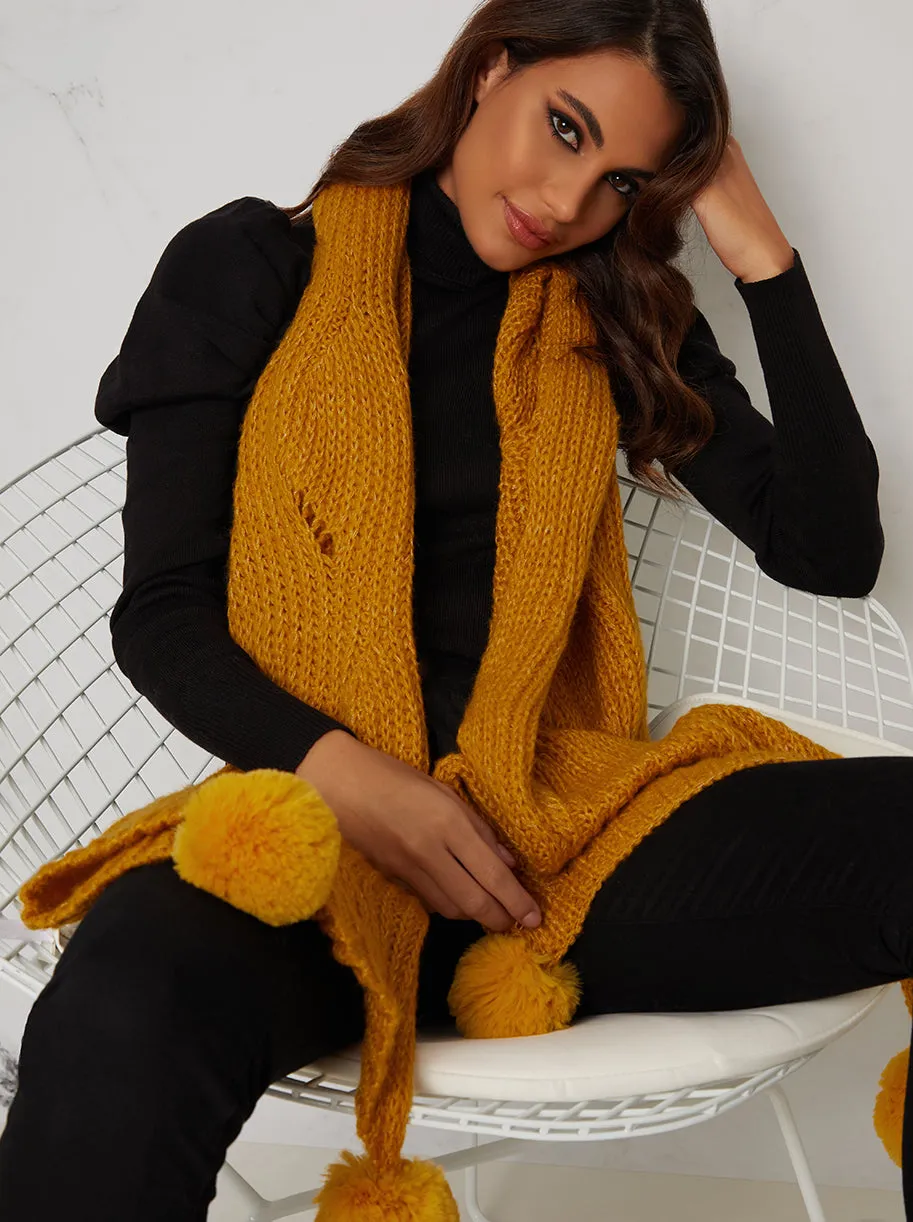 Winter Scarf with Pom Pom Detail in Yellow sold by Chi Chi London