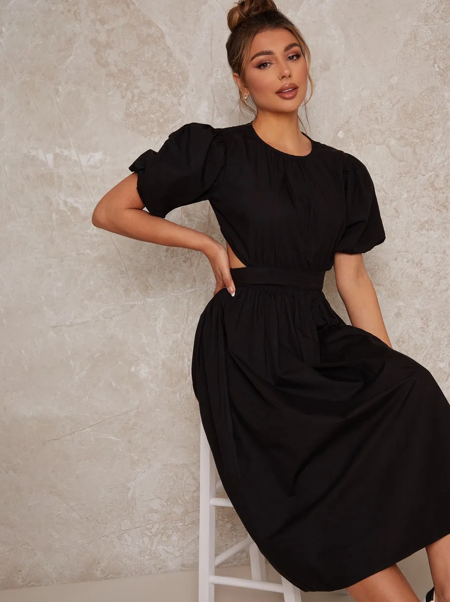Open Back Puff Sleeve Midi Smock Dress in Black sold by Chi Chi London