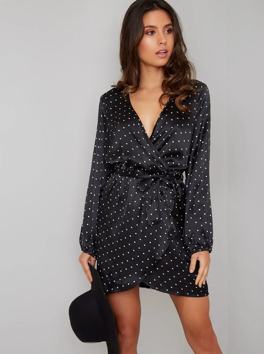 Polka Dot Wrap Silky Mini Dress in Black sold by Chi Chi London