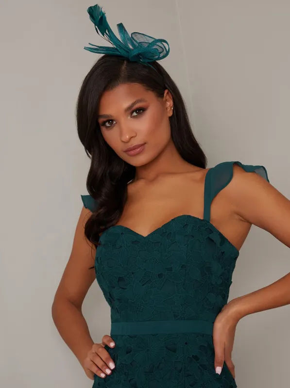 Feather Design Headband Fascinator in Green made by Chi Chi London