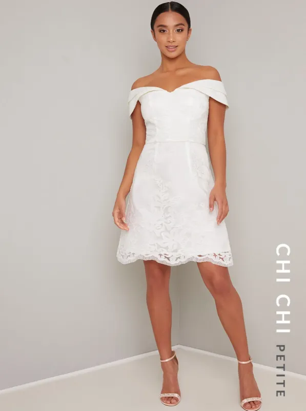Petite Embroidered Overlay Mini Dress in White sold by Chi Chi London