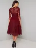 Sheer Sleeved Lace Bodice Midi Dress in Red sold by Chi Chi London
