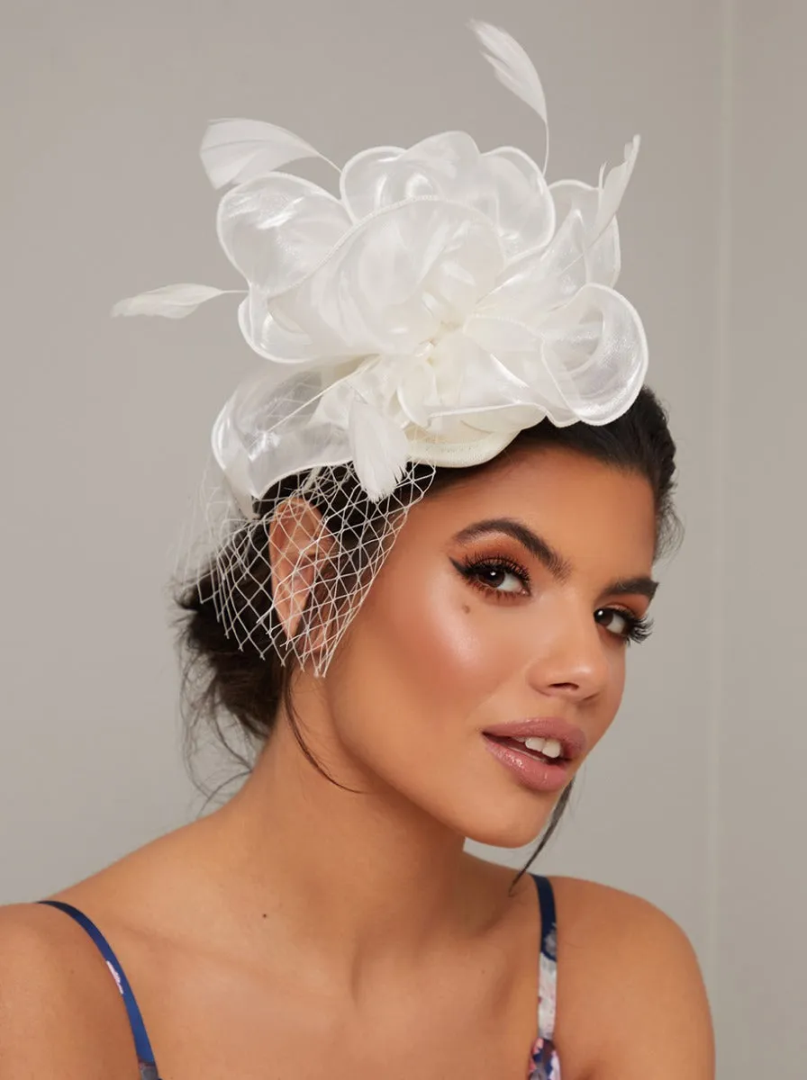 Flower Fascinator Headband Hat with Feather in Cream sold by Chi Chi London