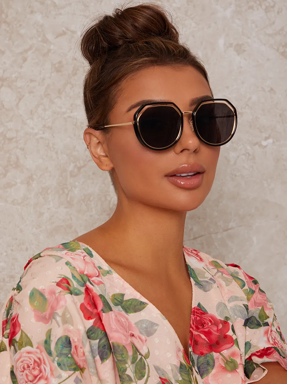 Oversized Sunglasses with Cut-Out Frame in Black sold by Chi Chi London