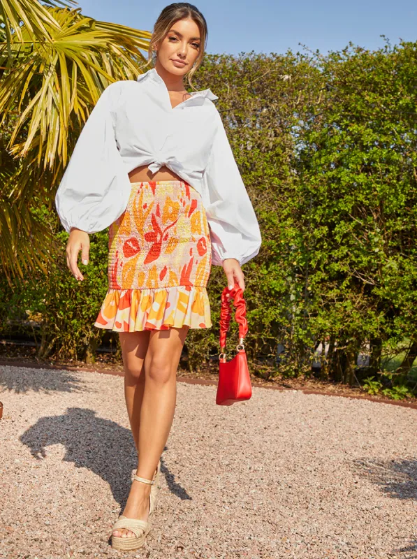 Ruffle Shirred Abstract Print Mini Skirt in Orange sold by Chi Chi London