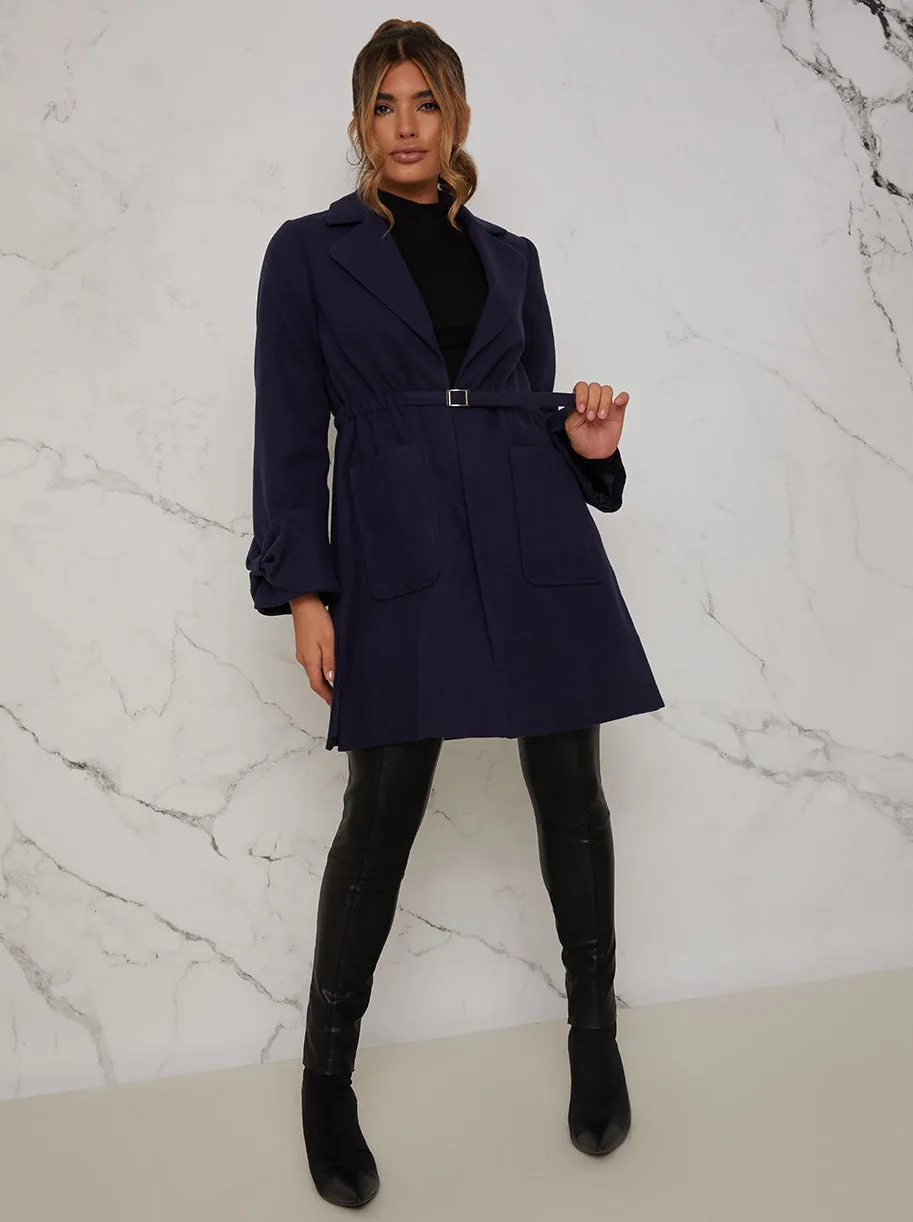 Structured Coat with Bow Sleeves and Belt in Navy sold by Chi Chi London