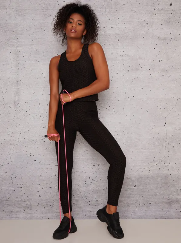 Mid Rise Waffle Detail Gym Leggings in Black sold by Chi Chi London