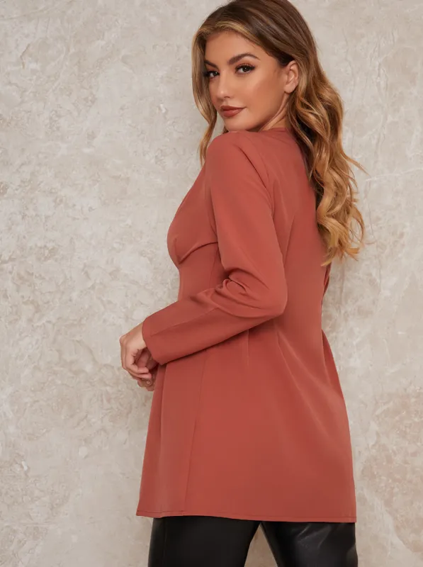 Long Sleeved Button Through Pleat Shirt In Orange sold by Chi Chi London