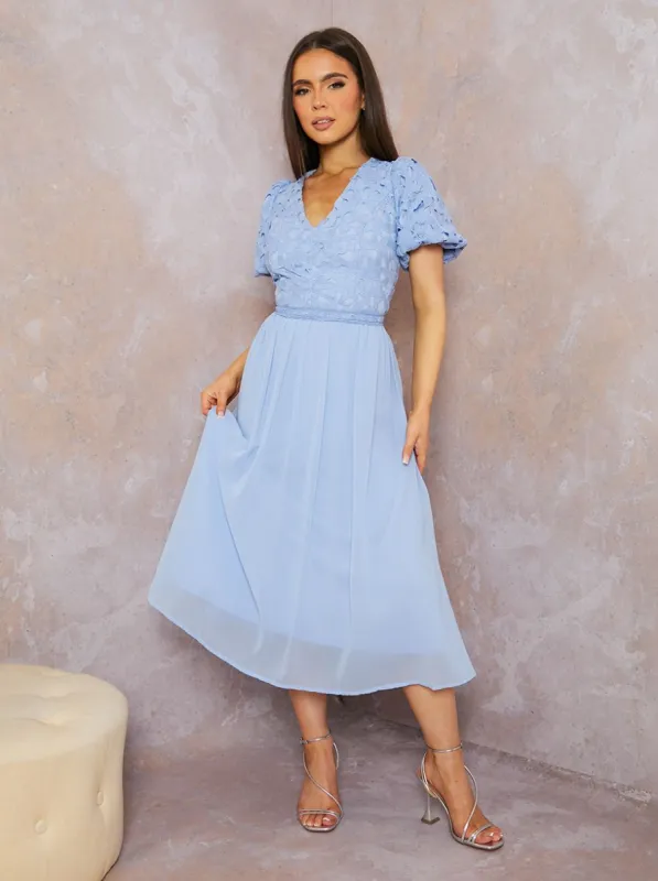 Puff Sleeve Premium Lace Midi Dress in Blue sold by Chi Chi London
