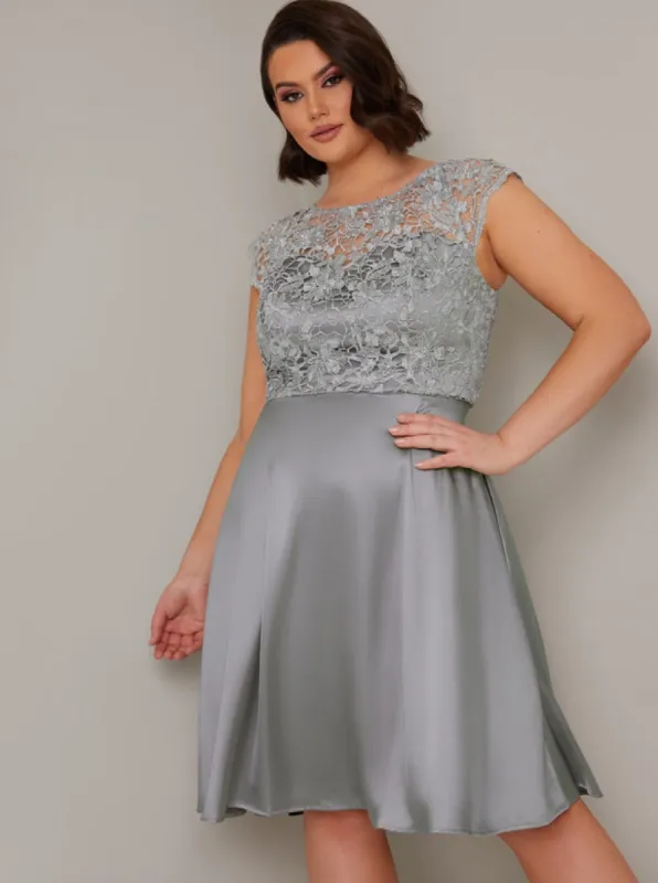 Plus Size Crochet Lace Bodice Satin Midi Dress in Green sold by Chi Chi London