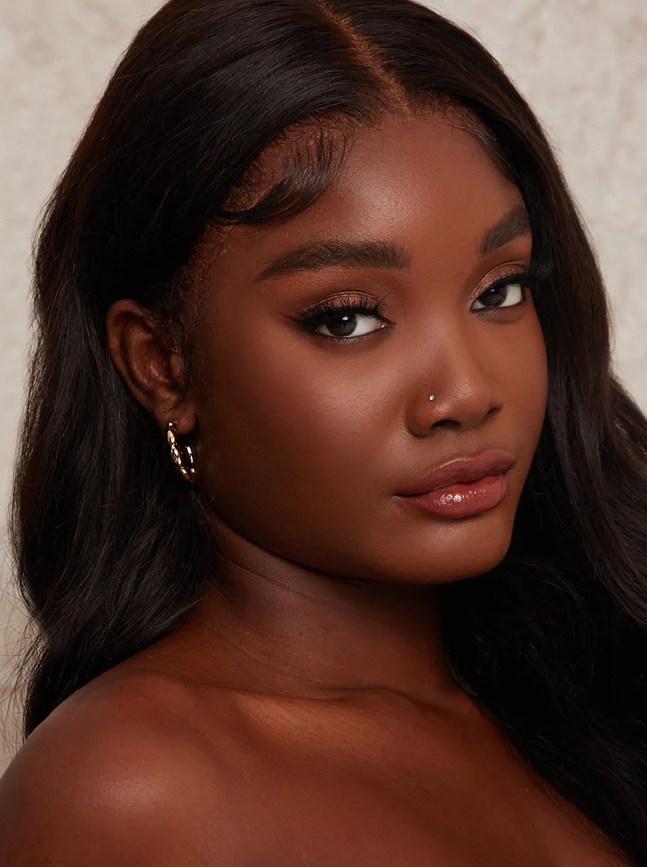 Twist Hoop Earrings in Gold sold by Chi Chi London