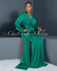 *Martina Green Plunging Neckline Draped Maxi Dress sold by Chic Couture