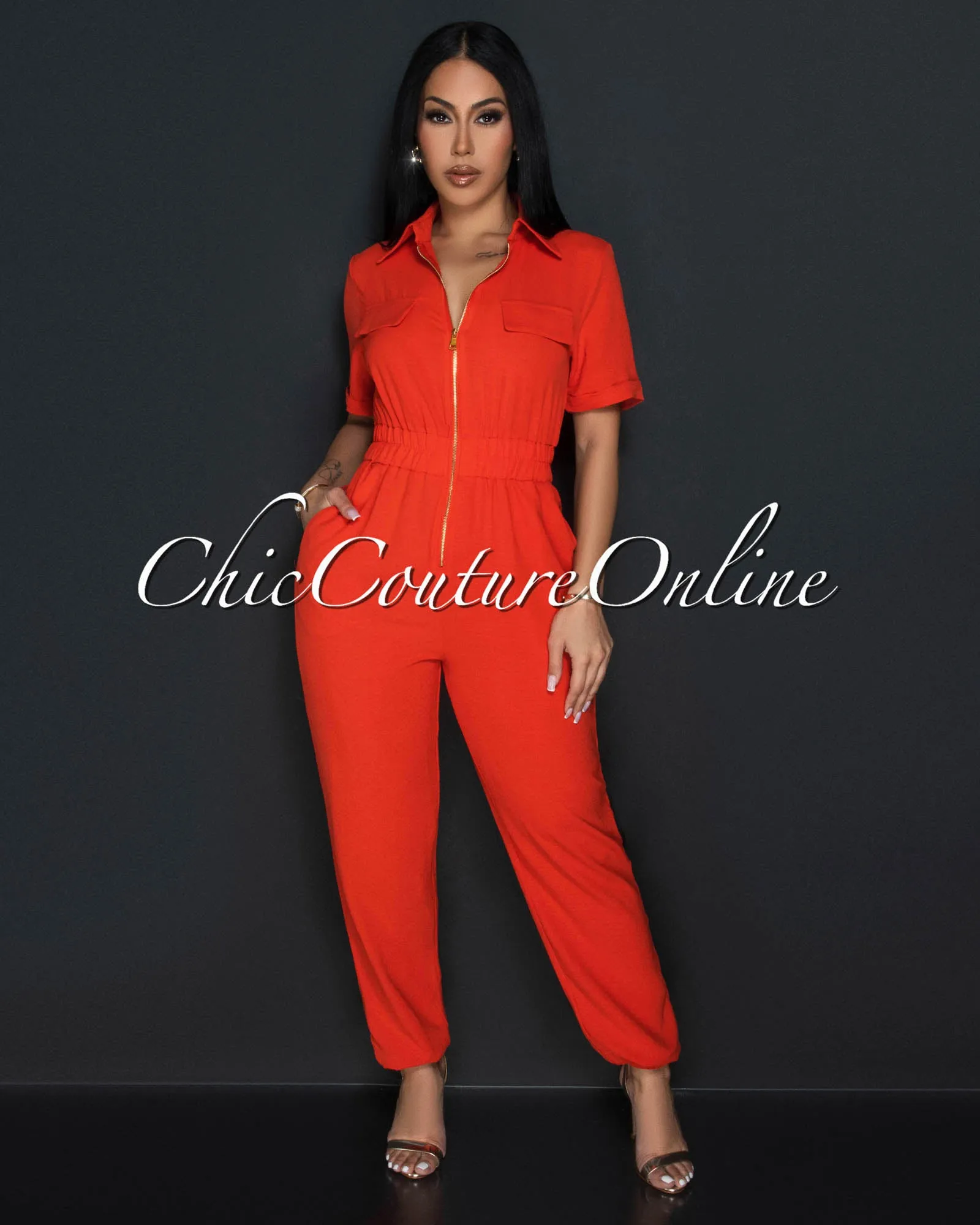 *Sumi Orange Utility Cargo Jumpsuit sold by Chic Couture