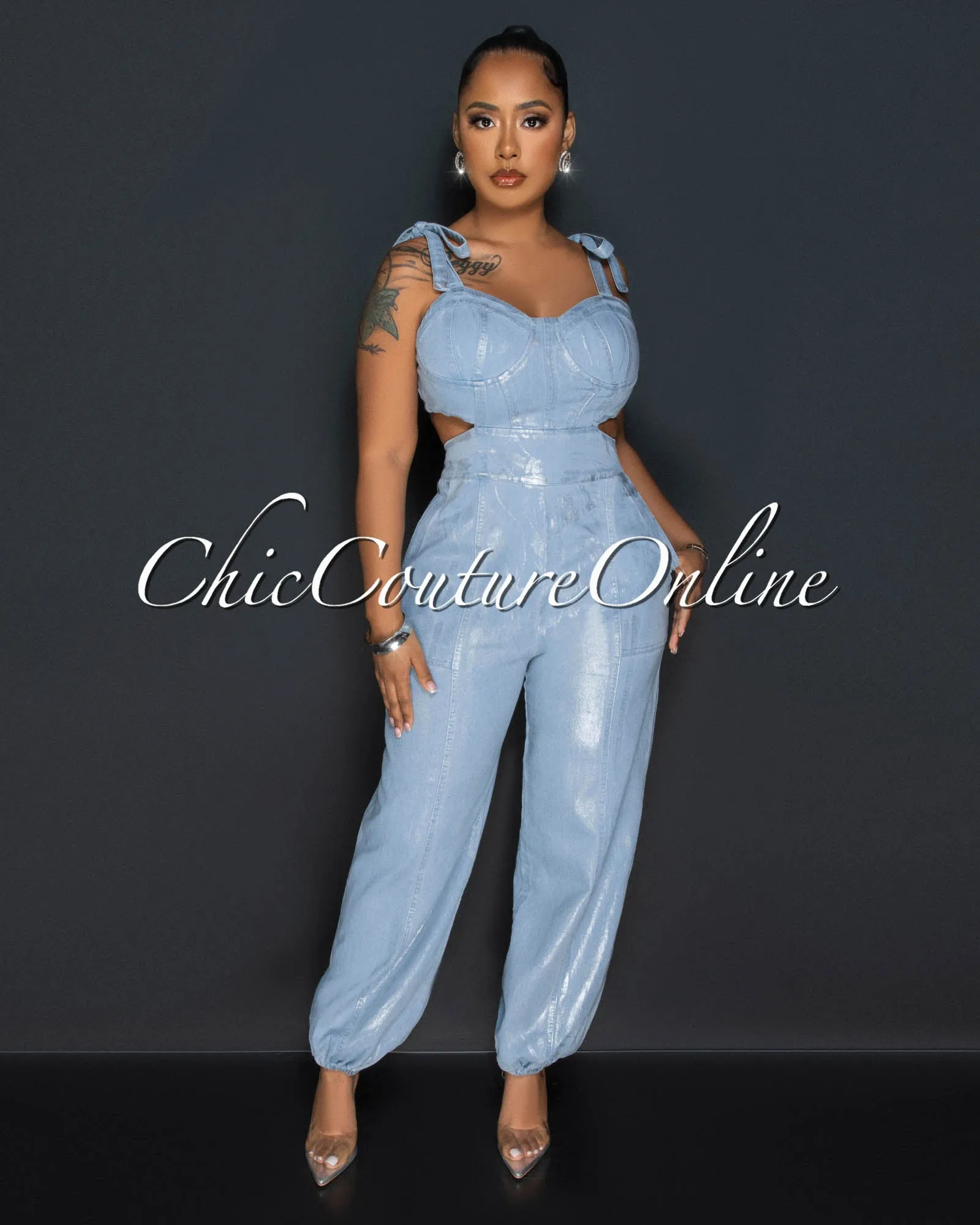 *Lazza Light Denim Silver Foil Back Cut-Out Jumpsuit sold by Chic Couture