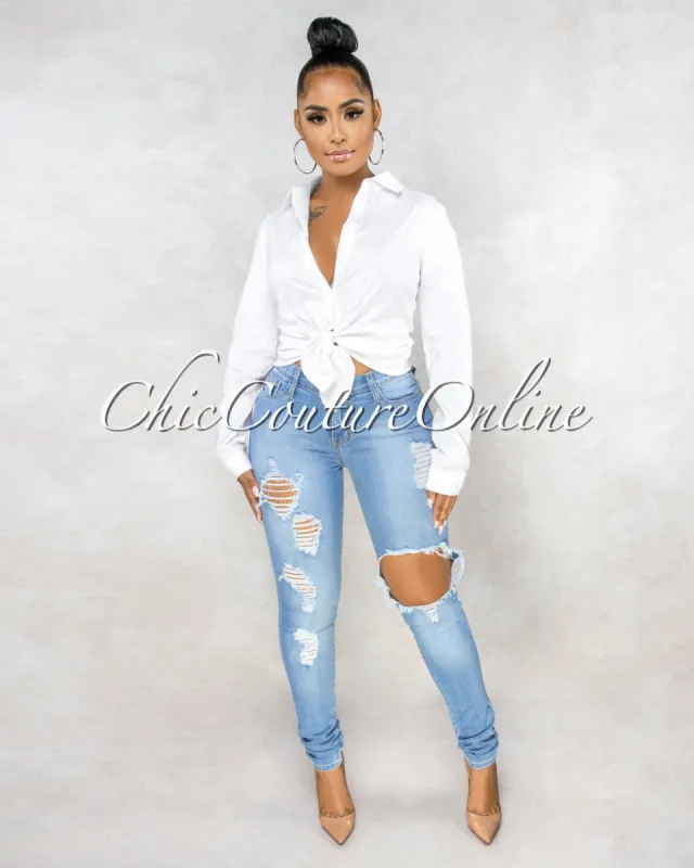 *Evinna Light Wash Destroyed Denim Mid Waist Jeans sold by Chic Couture