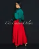 *Mallea Red Textured Silky Skirt sold by Chic Couture