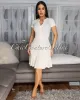 Kiki Cream Ribbed Knit Dress sold by Chic Couture