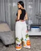 Miami Cream Multi-Color Print Pants sold by Chic Couture