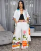 Miami Cream Multi-Color Print Maxi Dress sold by Chic Couture