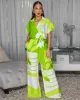 Darling Green Off-White Print Jumpsuit sold by Chic Couture