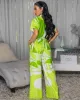 Darling Green Off-White Print Jumpsuit sold by Chic Couture